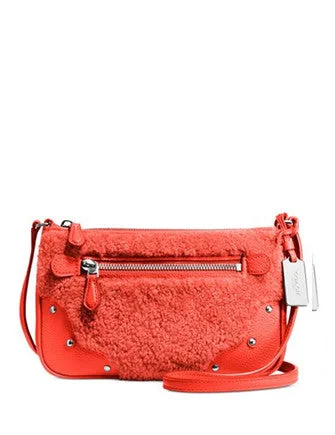 Vintage Bags For Retro And Classic Fashion Lovers Coach Small Rhyder Pochette in Shearling Trendy And Timeless Handbags Now On Sale